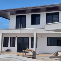 Beach Residence with Black PVC carpentry
